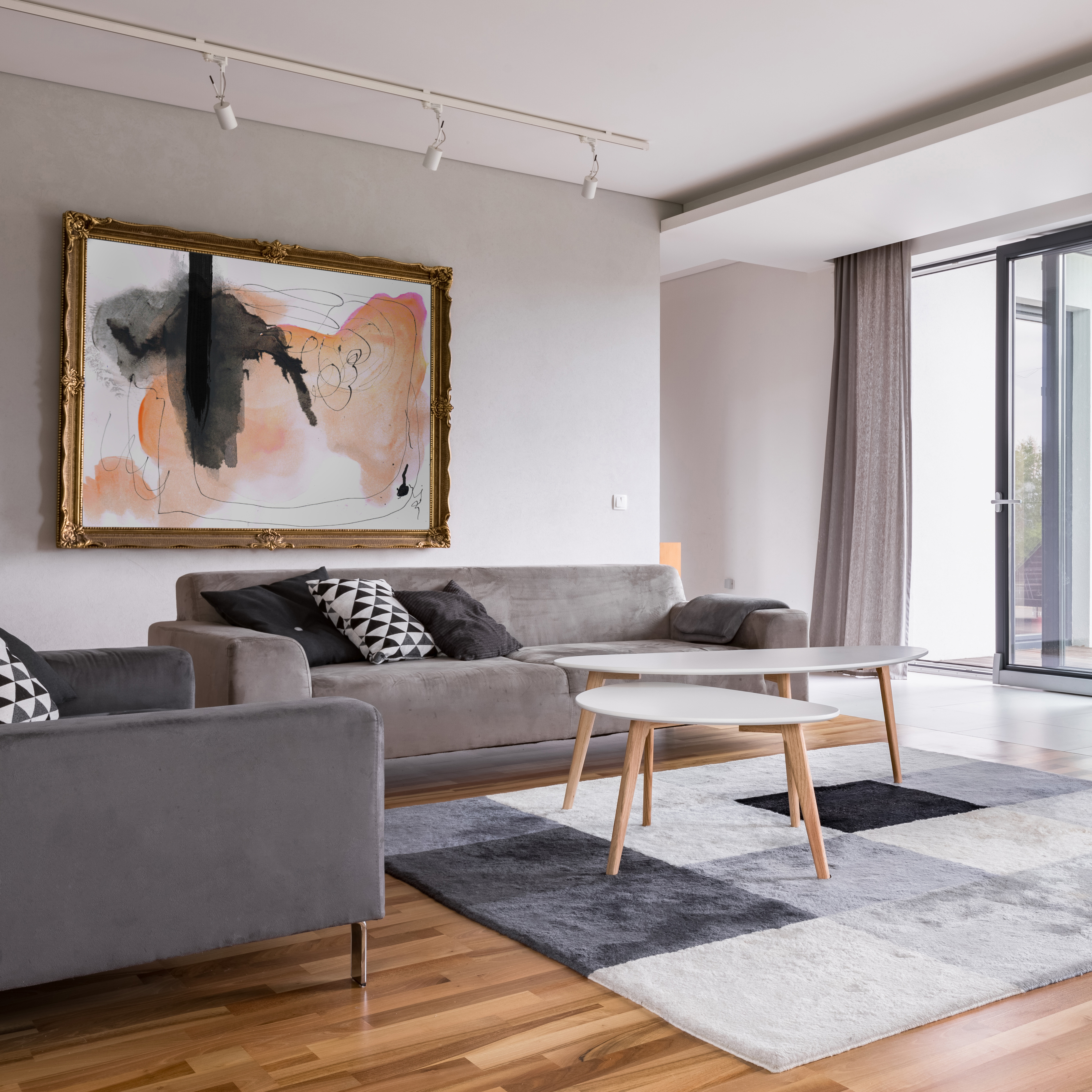 Square frame of modern living room with sofa, pattern carpet and balcony